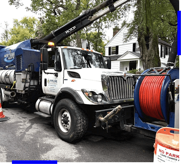 A utility truck with equipment parked on a residential street.